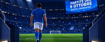 Partite del 9 ottobre: quote e pronostici: calciatore di spalle entra in campo in uno stadio illuminato